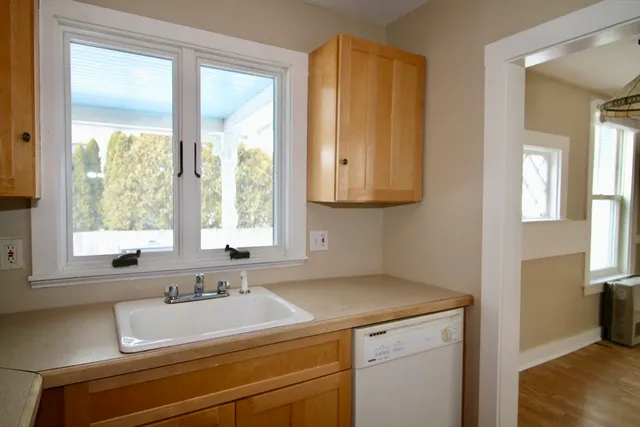 a bathroom with a sink and a window