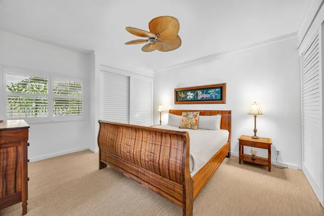 a bed room with a bed and a chandelier