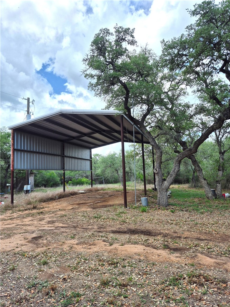 1632 Slickfield Road Yorktown, TX 78164 - Photo 21 of 40 a backyard of a house with lots of green space