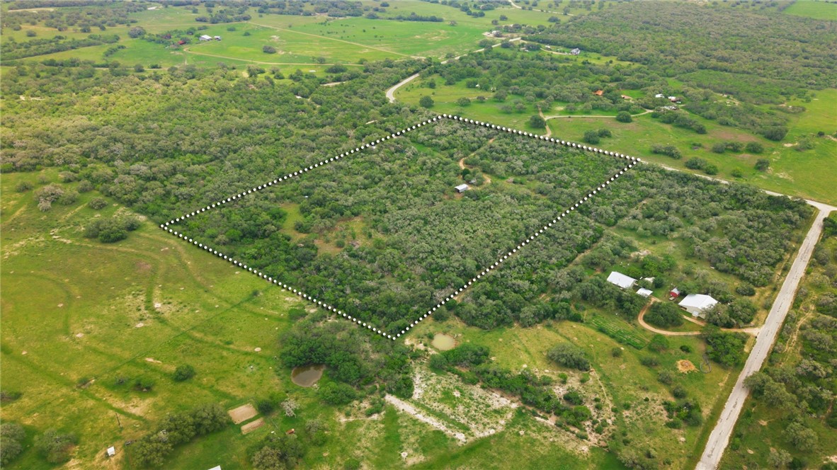 1632 Slickfield Road Yorktown, TX 78164 - Photo 31 of 40 a view of a big yard with lots of green space and plants