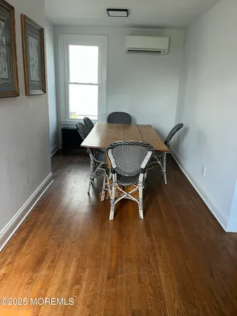 a workspace with furniture window and wooden floor