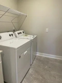 a utility room with dryer and washer