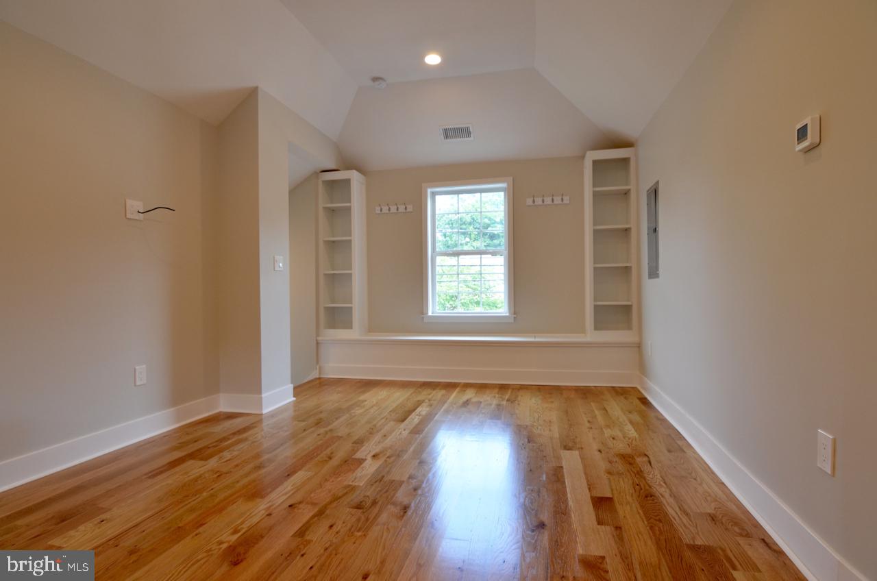400 West Wayne Avenue, Unit 3 Wayne, PA 19087 - Photo 6 of 14 wooden floor in an empty room with a window