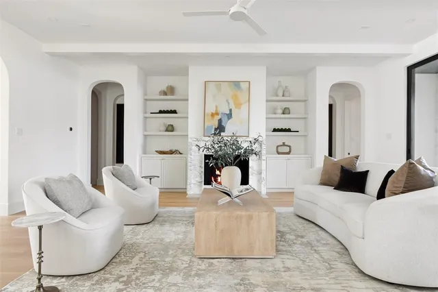 a living room with furniture and a potted plant