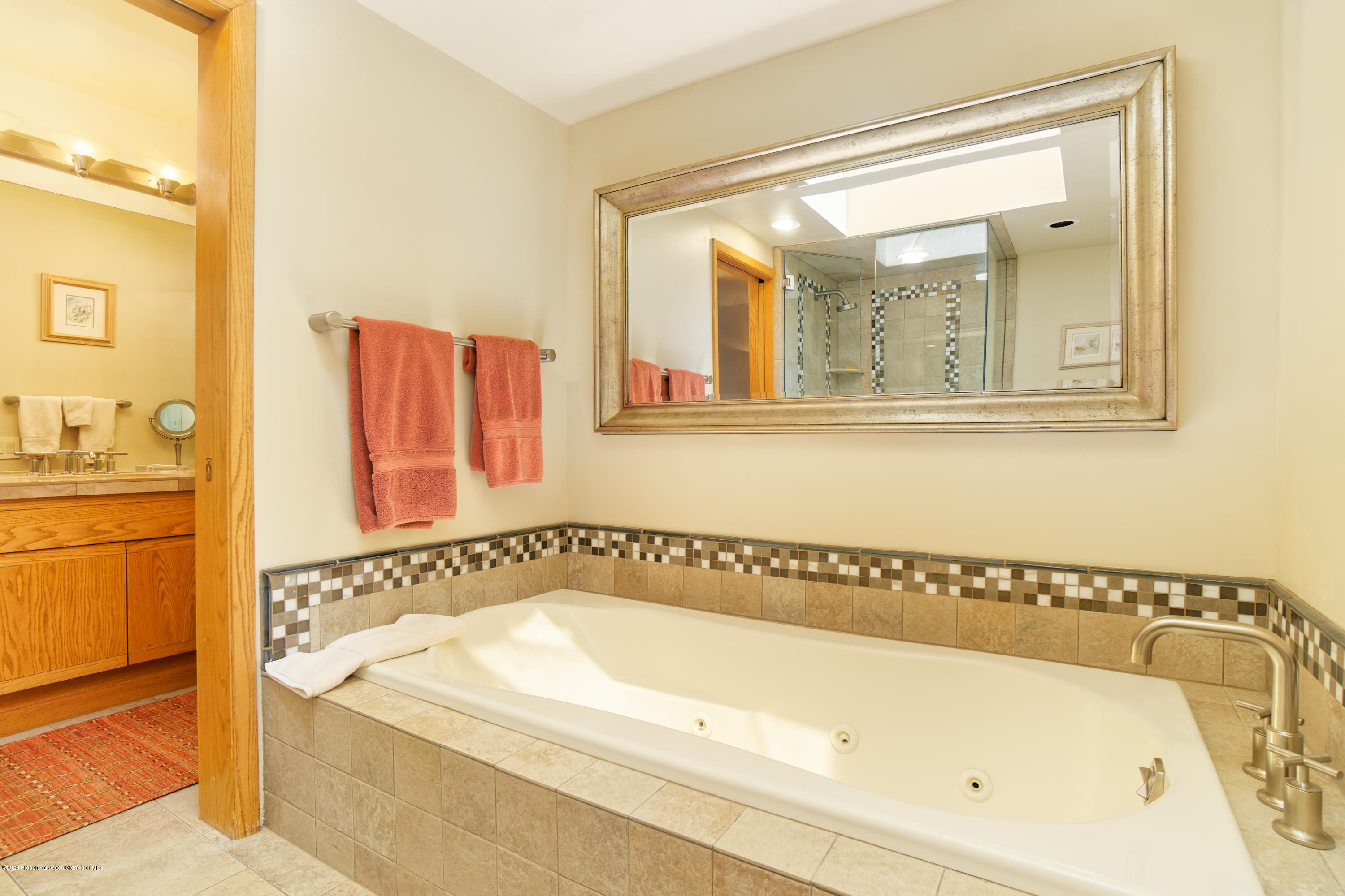 800 Ridge Road, Unit 9 Snowmass Village, CO 81615 - Photo 12 of 42 a bathroom with a bathtub and a shower