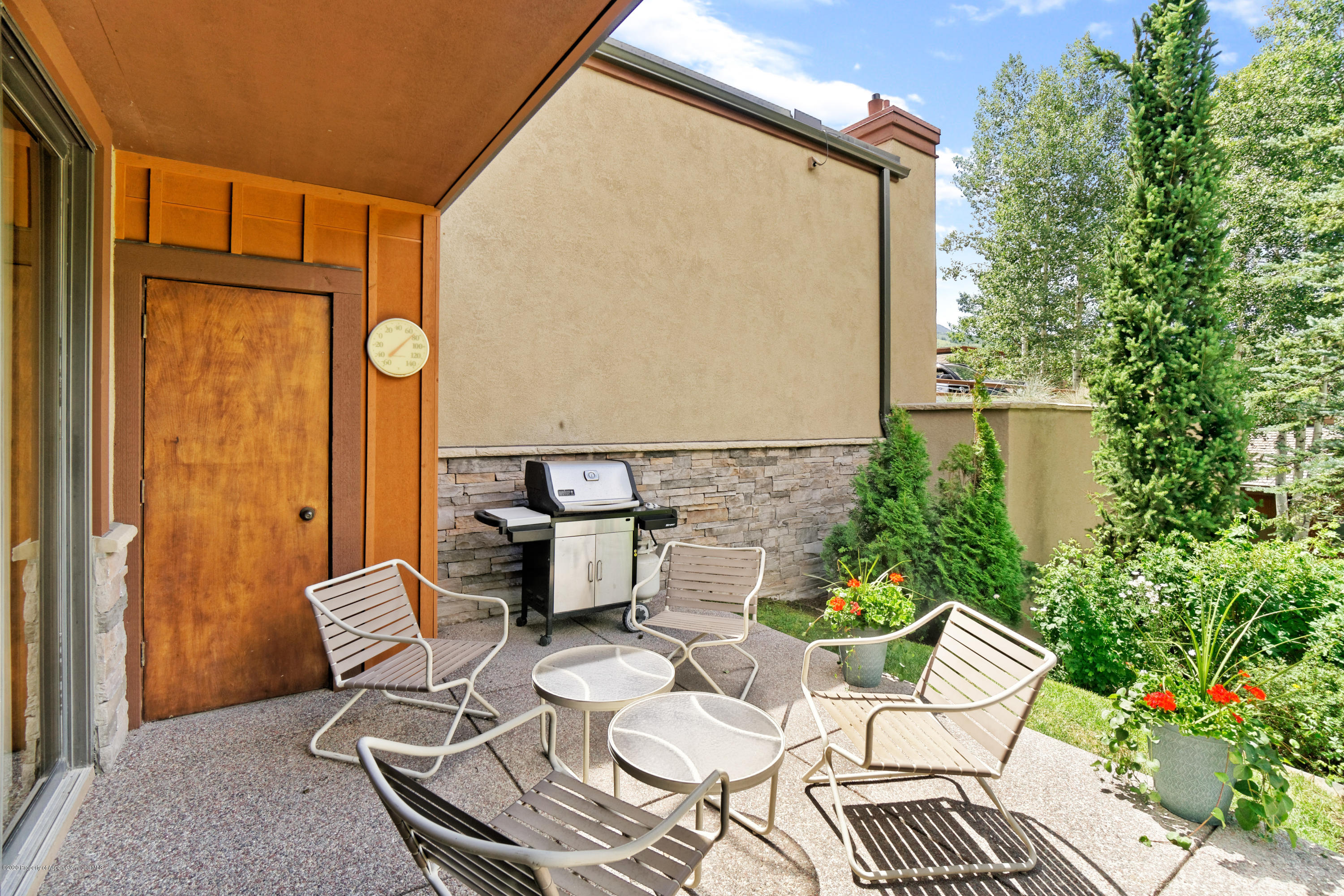 800 Ridge Road, Unit 9 Snowmass Village, CO 81615 - Photo 19 of 42 a view of a chairs and table in the back