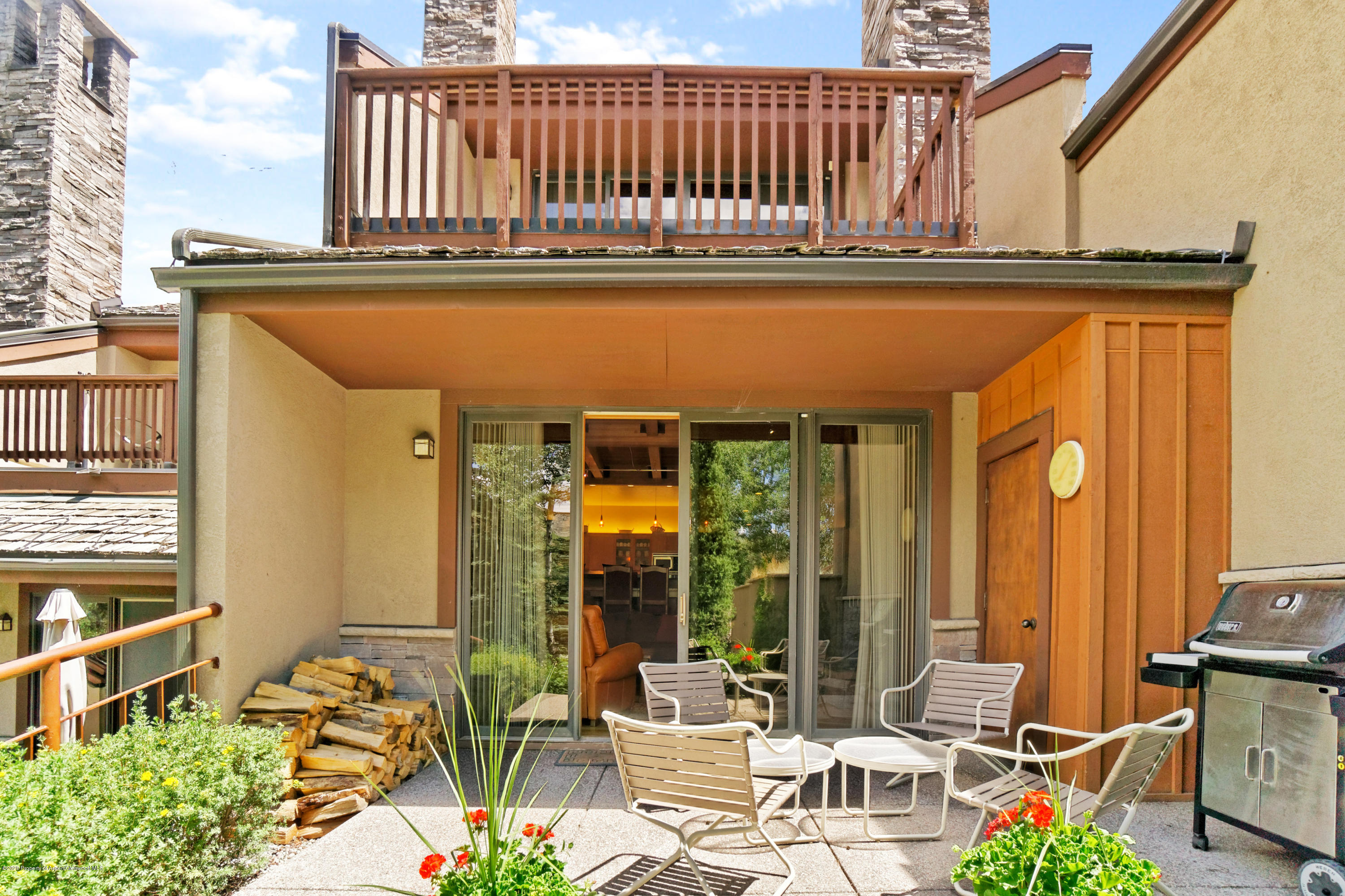 800 Ridge Road, Unit 9 Snowmass Village, CO 81615 - Photo 20 of 42 a balcony with table and chairs