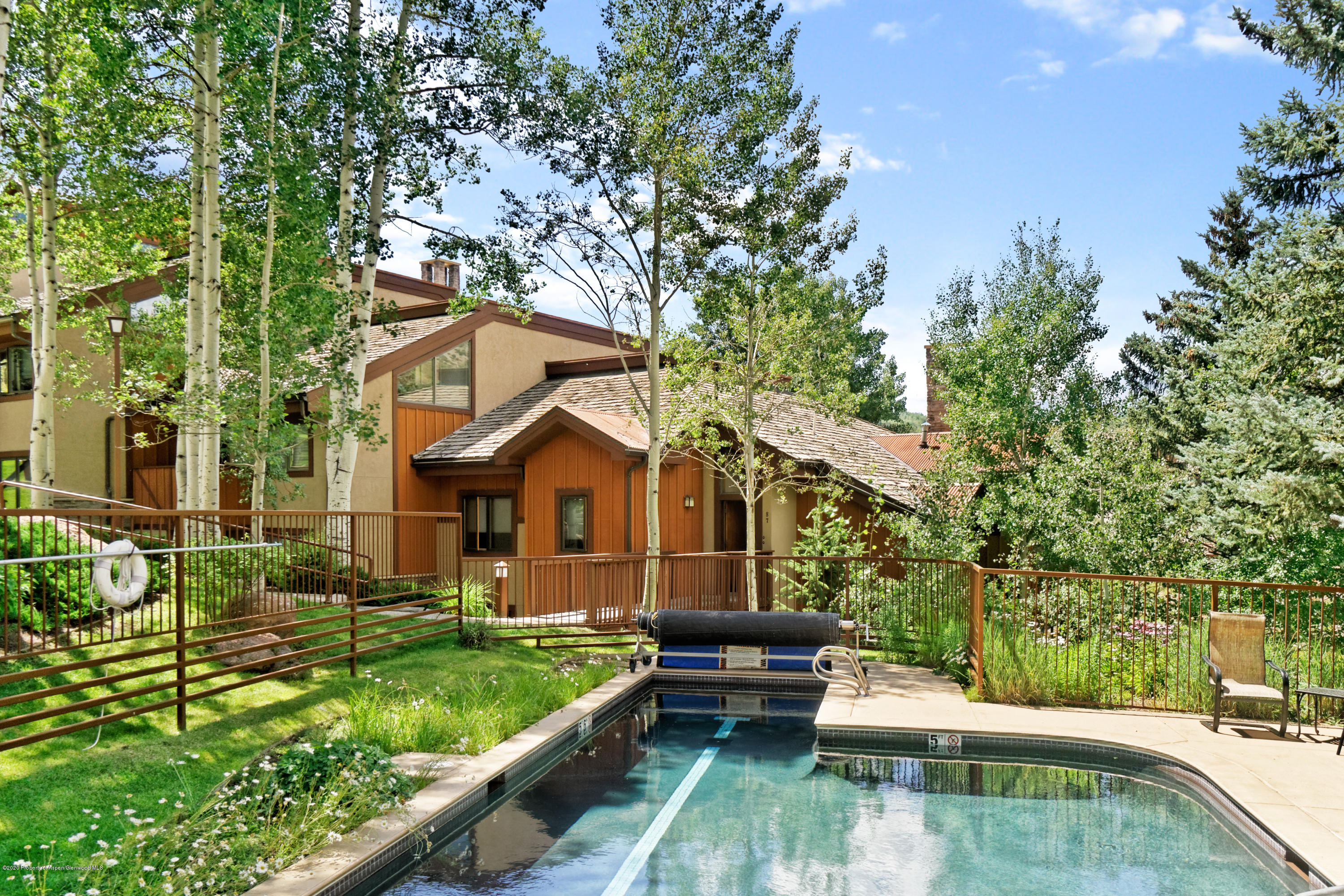 800 Ridge Road, Unit 9 Snowmass Village, CO 81615 - Photo 27 of 42 a front view of a house with garden