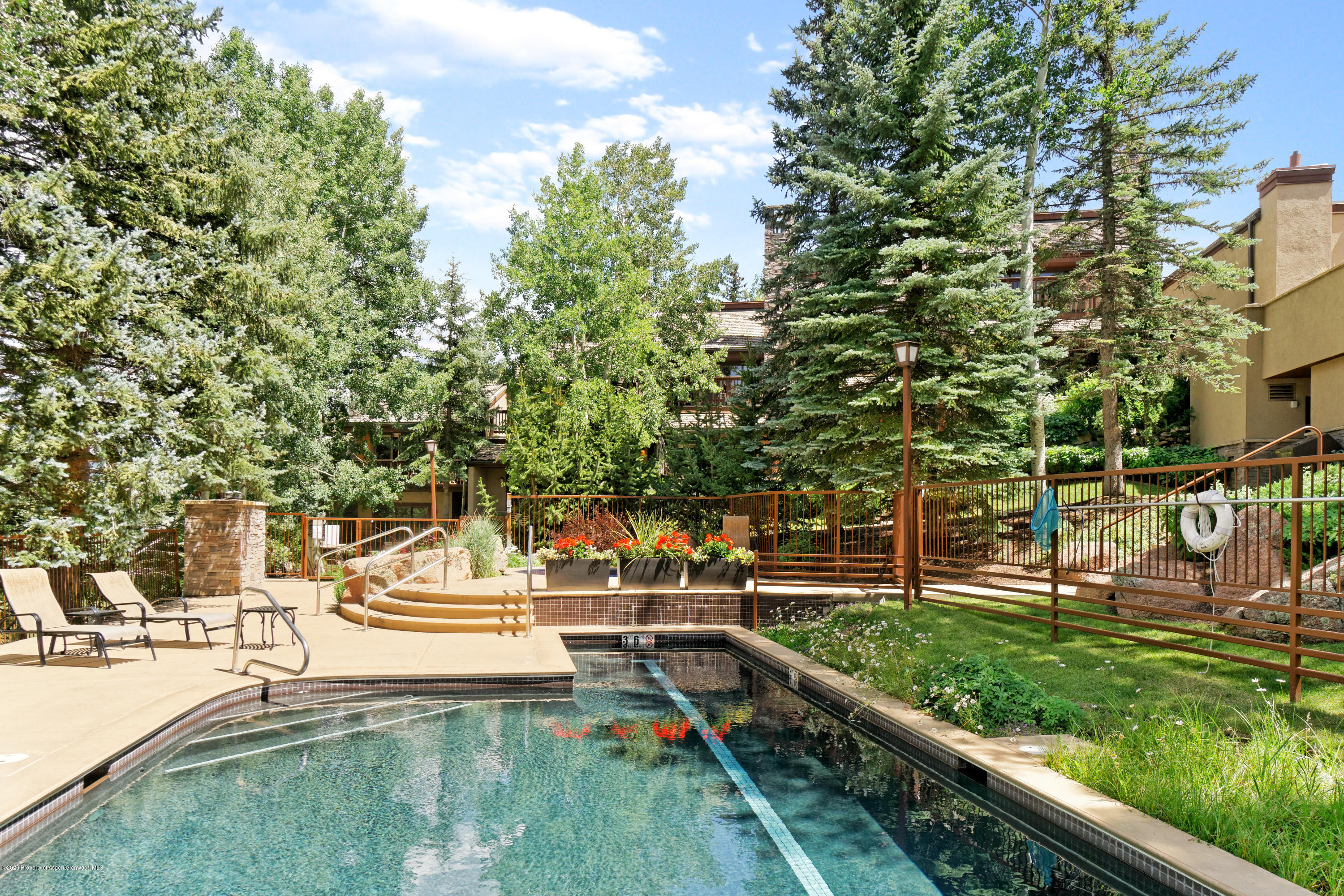 800 Ridge Road, Unit 9 Snowmass Village, CO 81615 - Photo 28 of 42 a view of a swimming pool with a yard