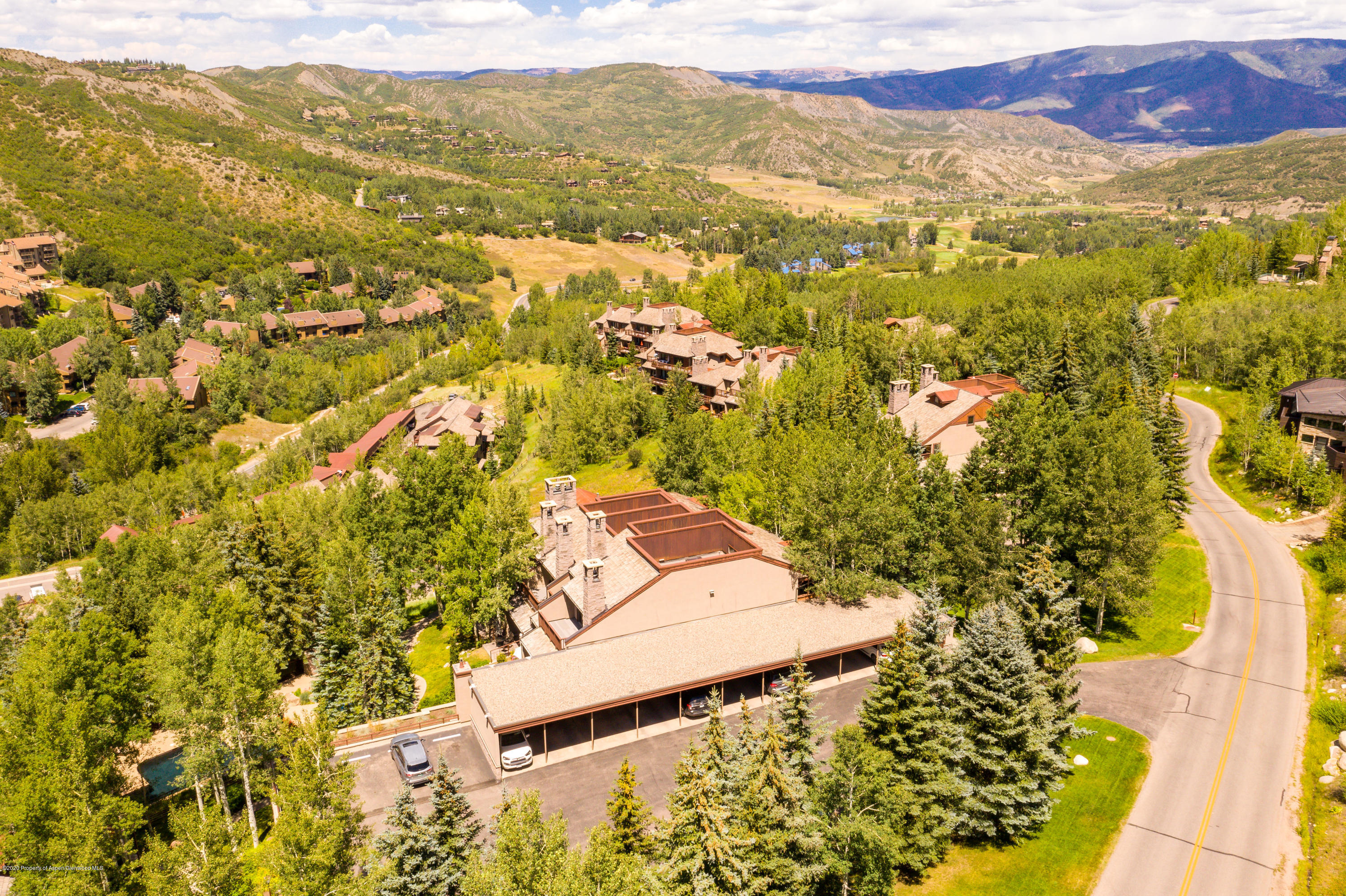 800 Ridge Road, Unit 9 Snowmass Village, CO 81615 - Photo 38 of 42 view of a city with mountains in the background