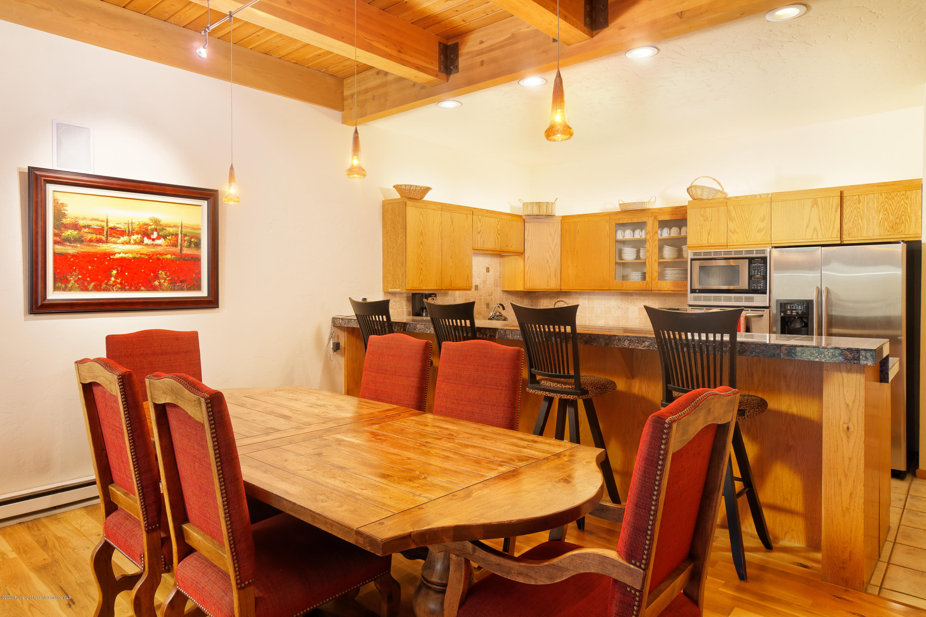 800 Ridge Road, Unit 9 Snowmass Village, CO 81615 - Photo 7 of 42 a dining room with furniture and a floor to ceiling window