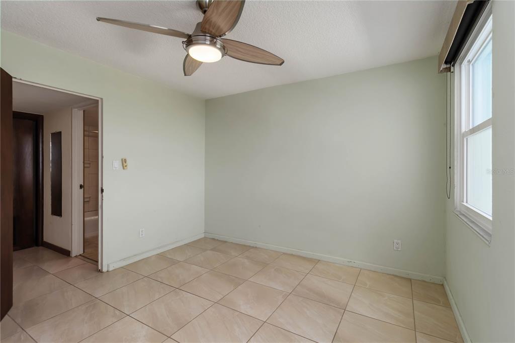 33 South Gulfstream Avenue, Unit 502 Sarasota, FL 34236 - Photo 15 of 23 an empty room with windows and fan