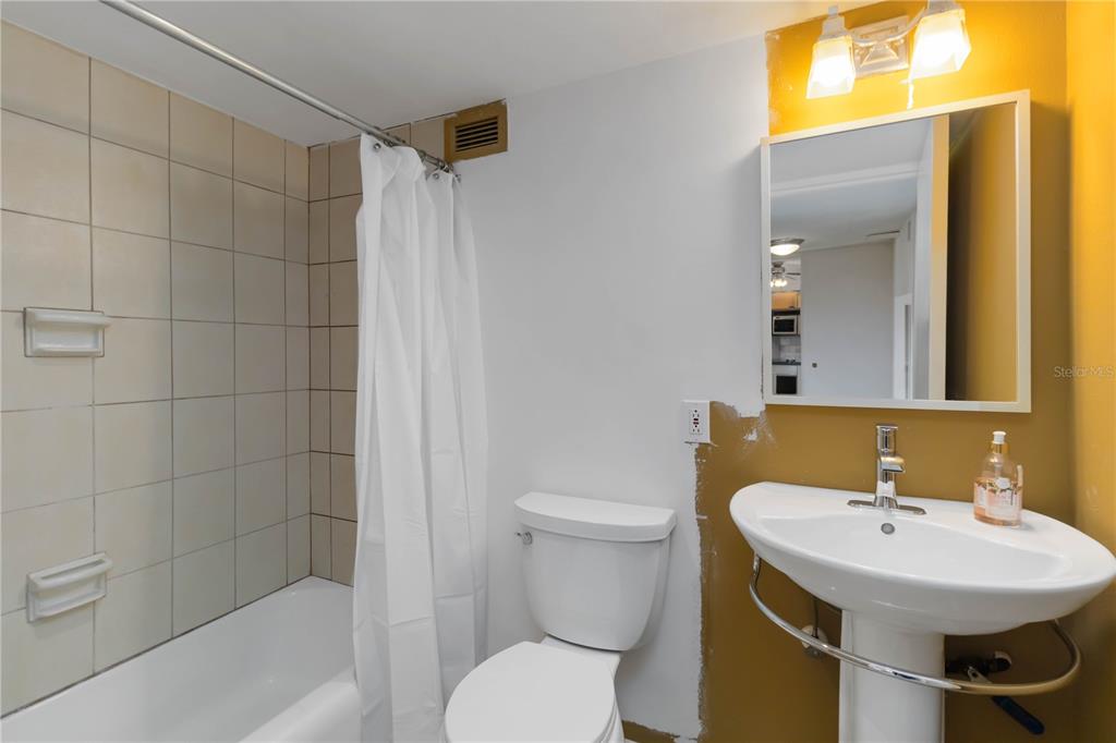 33 South Gulfstream Avenue, Unit 502 Sarasota, FL 34236 - Photo 17 of 23 a bathroom with a sink toilet and shower