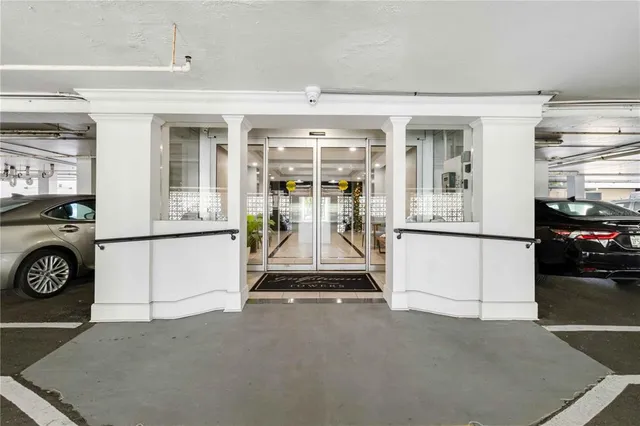 a lobby with furniture and potted plants