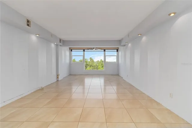 a view of an empty room with a window