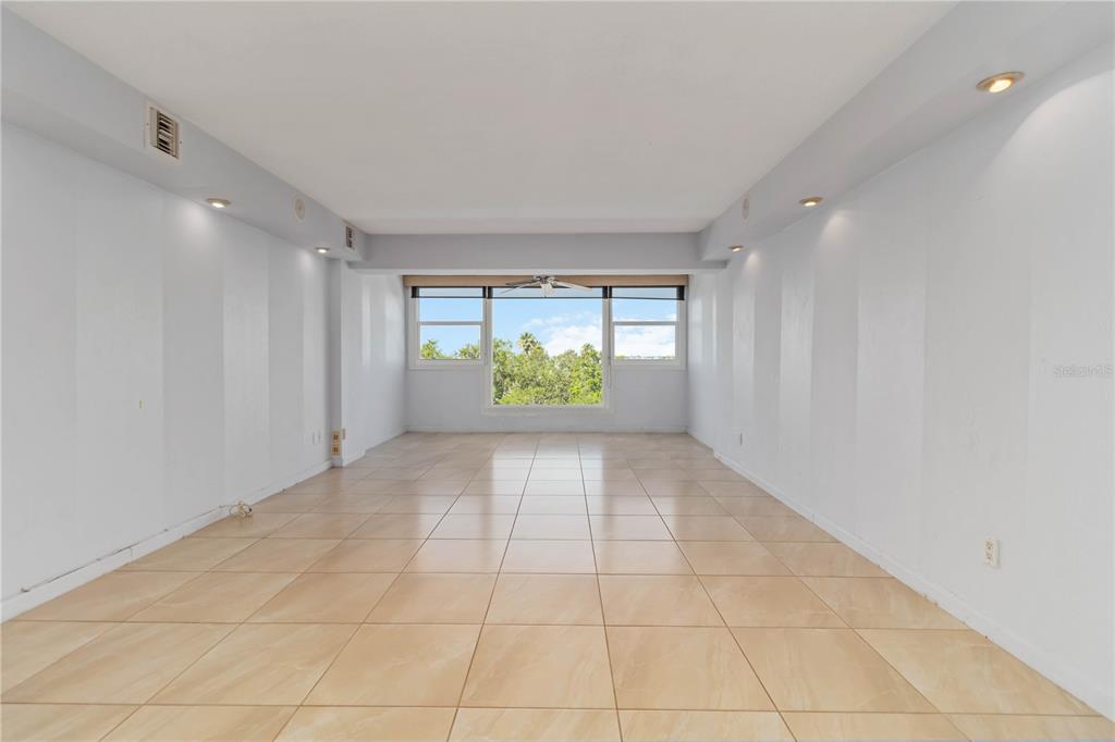 33 South Gulfstream Avenue, Unit 502 Sarasota, FL 34236 - Photo 6 of 23 a view of an empty room with a window