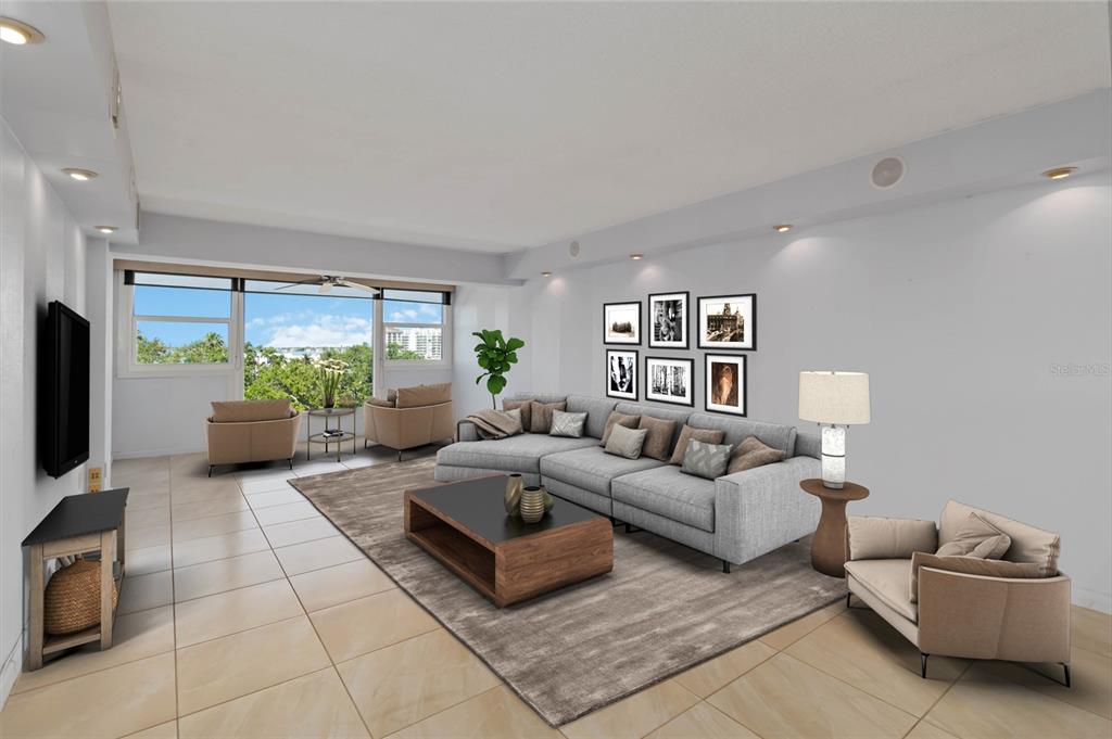 33 South Gulfstream Avenue, Unit 502 Sarasota, FL 34236 - Photo 7 of 23 a living room with furniture and a flat screen tv