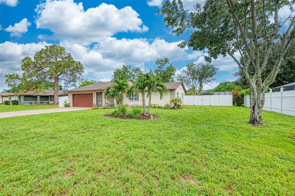 1330 Georgetowne Circle Sarasota, FL 34232 - Photo 2 of 46 a front view of a house with garden