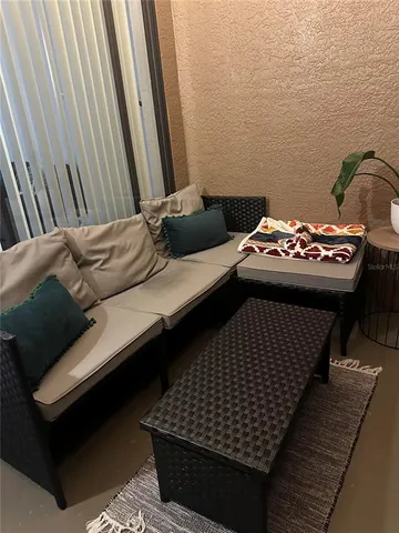 a bedroom with a bed and a ceiling fan