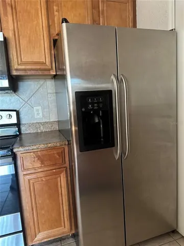 a close view of a storage and utility room with washer and dryer