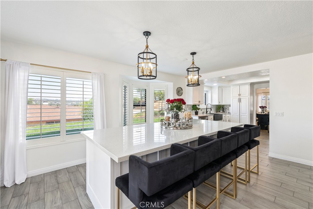 14272 Laurel Drive Riverside, CA 92503 - Photo 1 of 24 a view of a dining room with furniture window and wooden floor