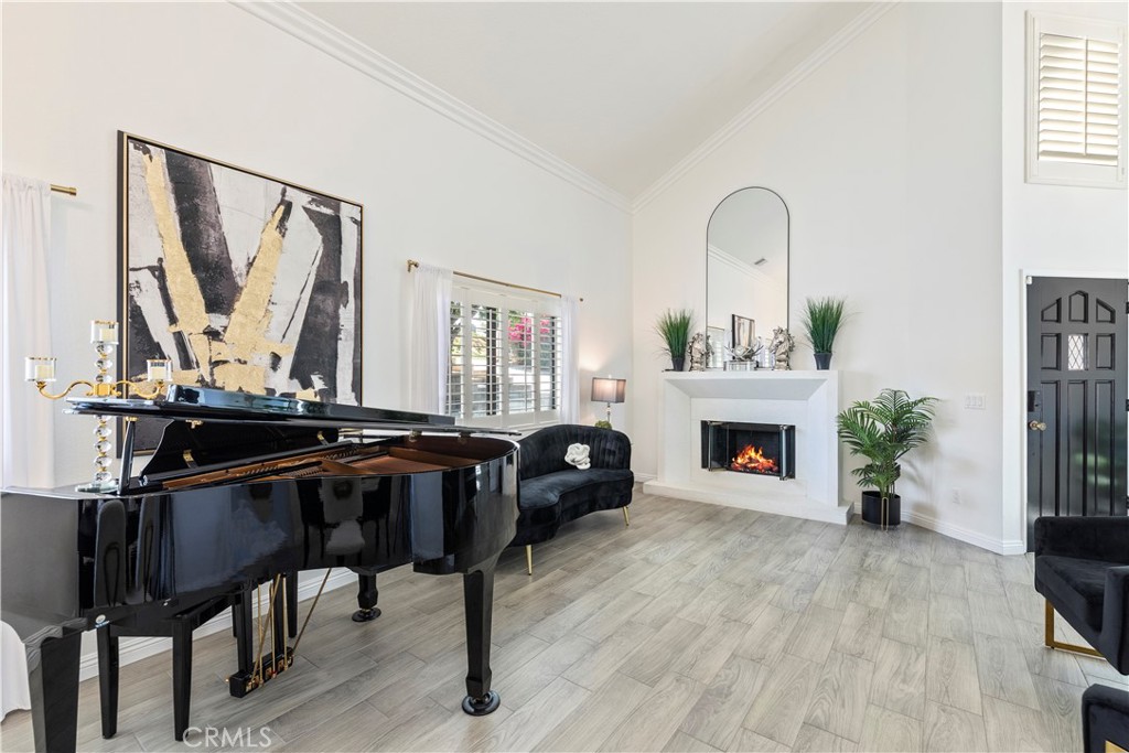 14272 Laurel Drive Riverside, CA 92503 - Photo 15 of 24 a living room with furniture and a fireplace