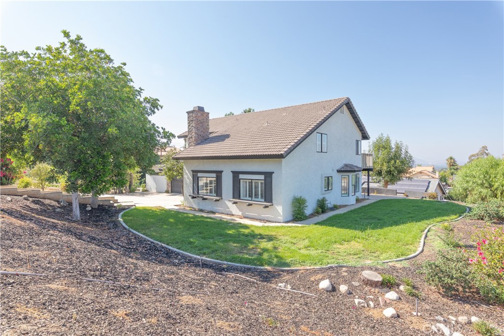 14272 Laurel Drive Riverside, CA 92503 - Photo 17 of 24 a view of a house with a yard