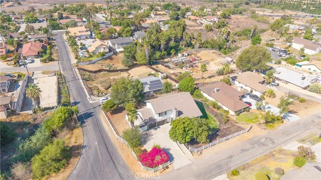 an aerial view of house with yard