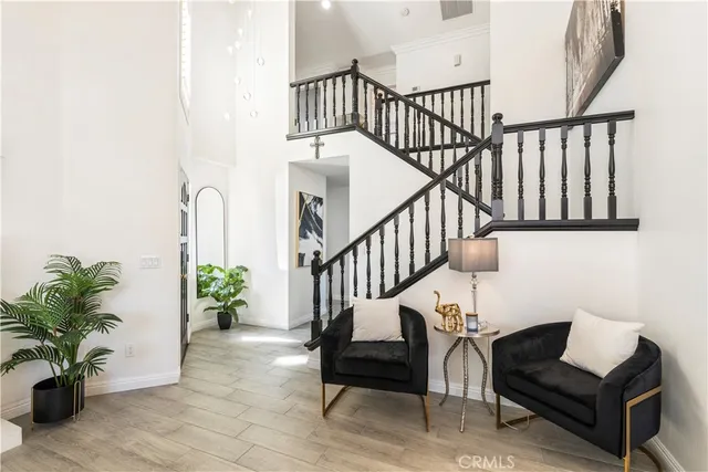 a view of entryway with wooden floor and a potted plant