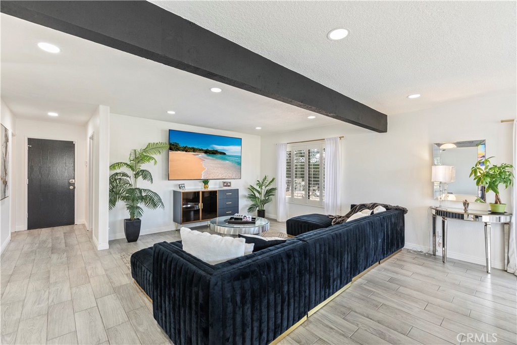 14272 Laurel Drive Riverside, CA 92503 - Photo 5 of 24 a living room with furniture kitchen view and a large window