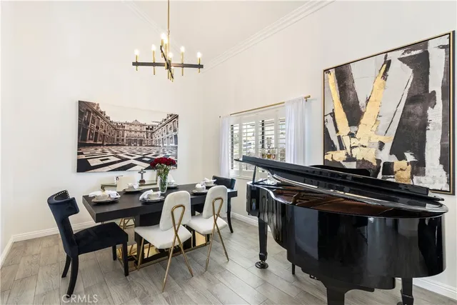 a dining room with furniture and window