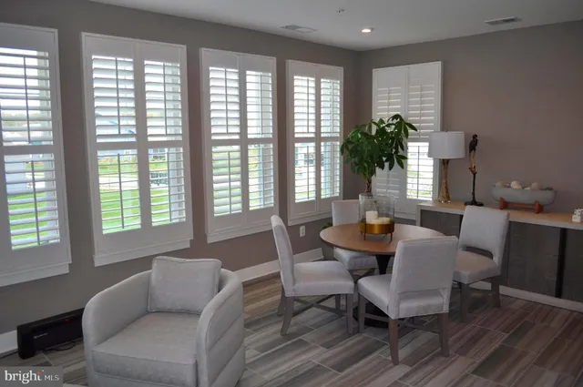 an aerial view of a house with a yard and lake view