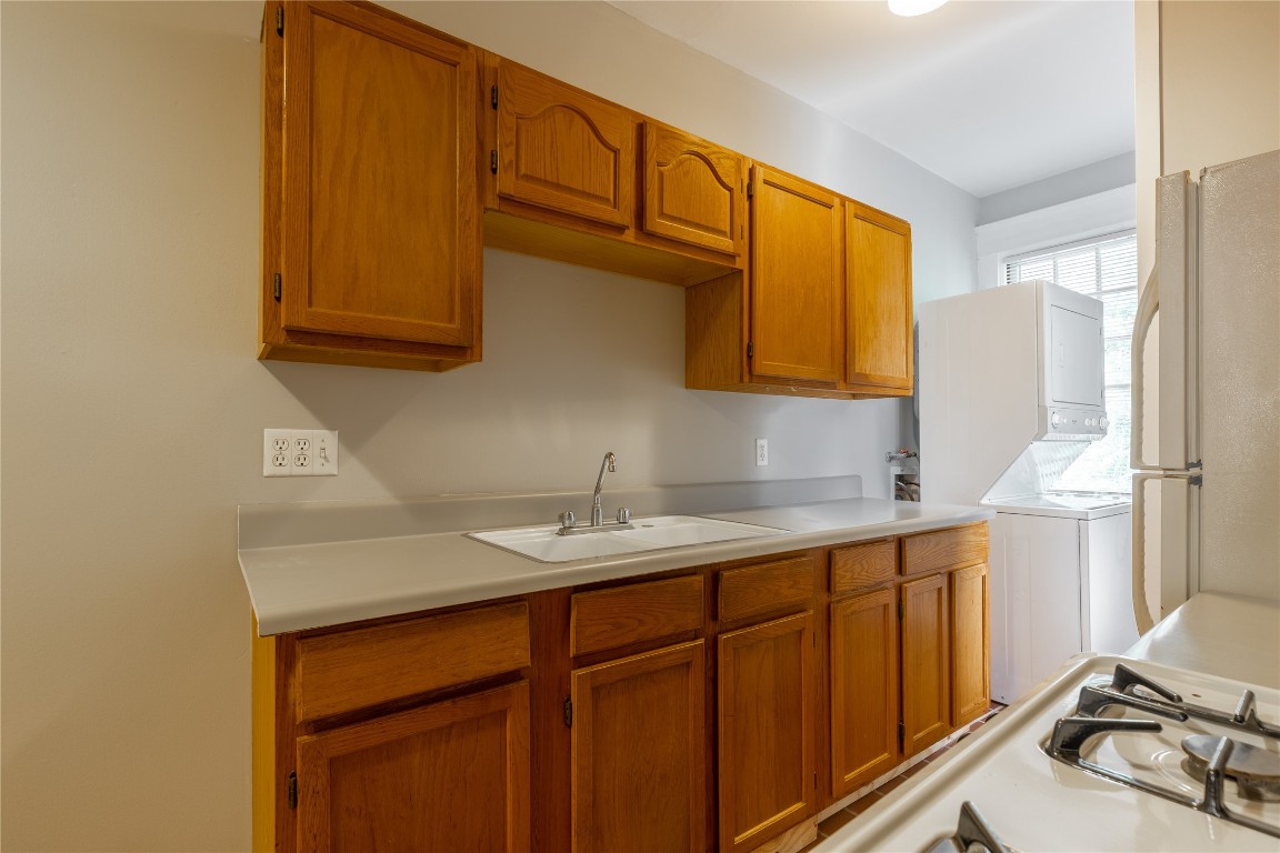 806 Winbern Street, Unit 2 Houston, TX 77002 - Photo 4 of 11 a kitchen with stainless steel appliances granite countertop a sink stove and cabinets