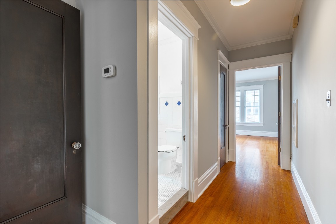 806 Winbern Street, Unit 2 Houston, TX 77002 - Photo 7 of 11 a view of a hallway with wooden floor
