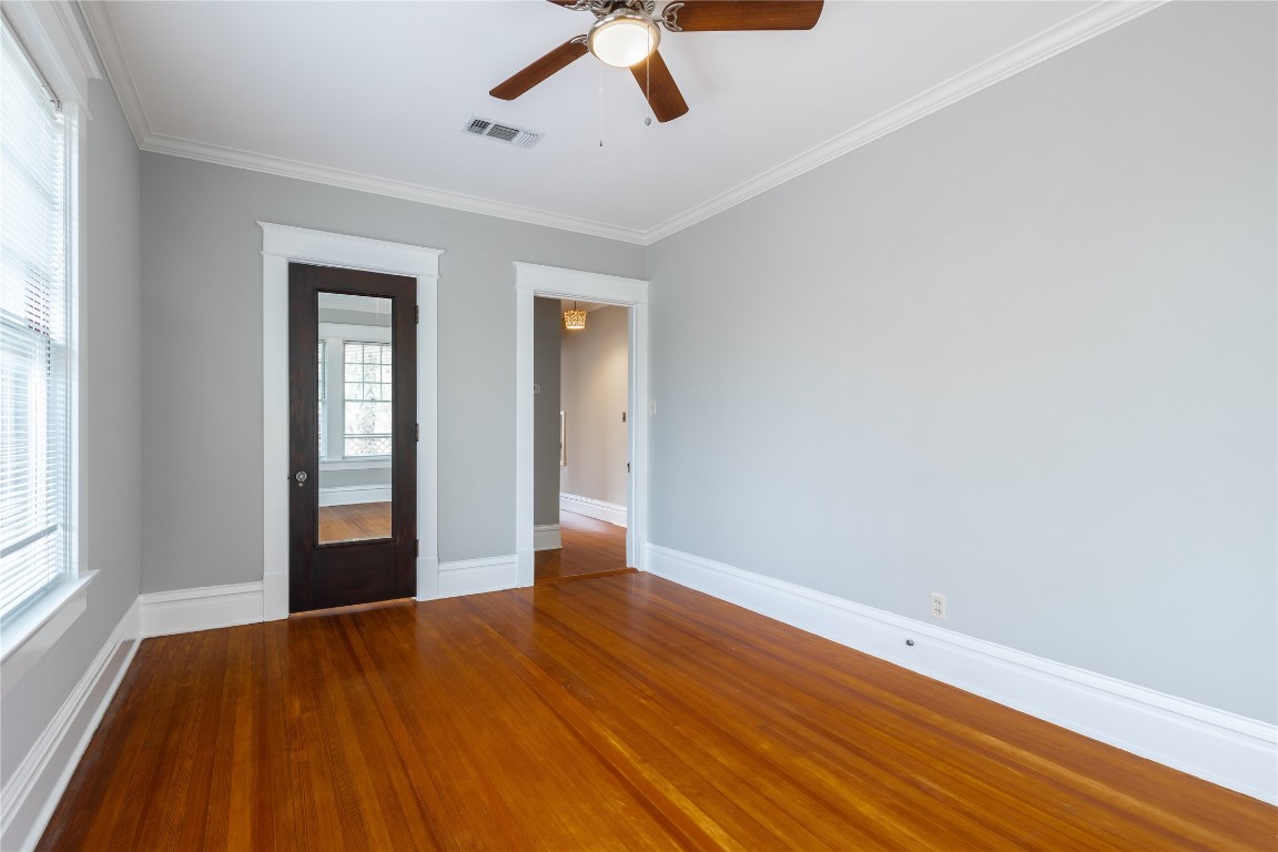 806 Winbern Street, Unit 2 Houston, TX 77002 - Photo 8 of 11 a view of empty room with wooden floor and fan