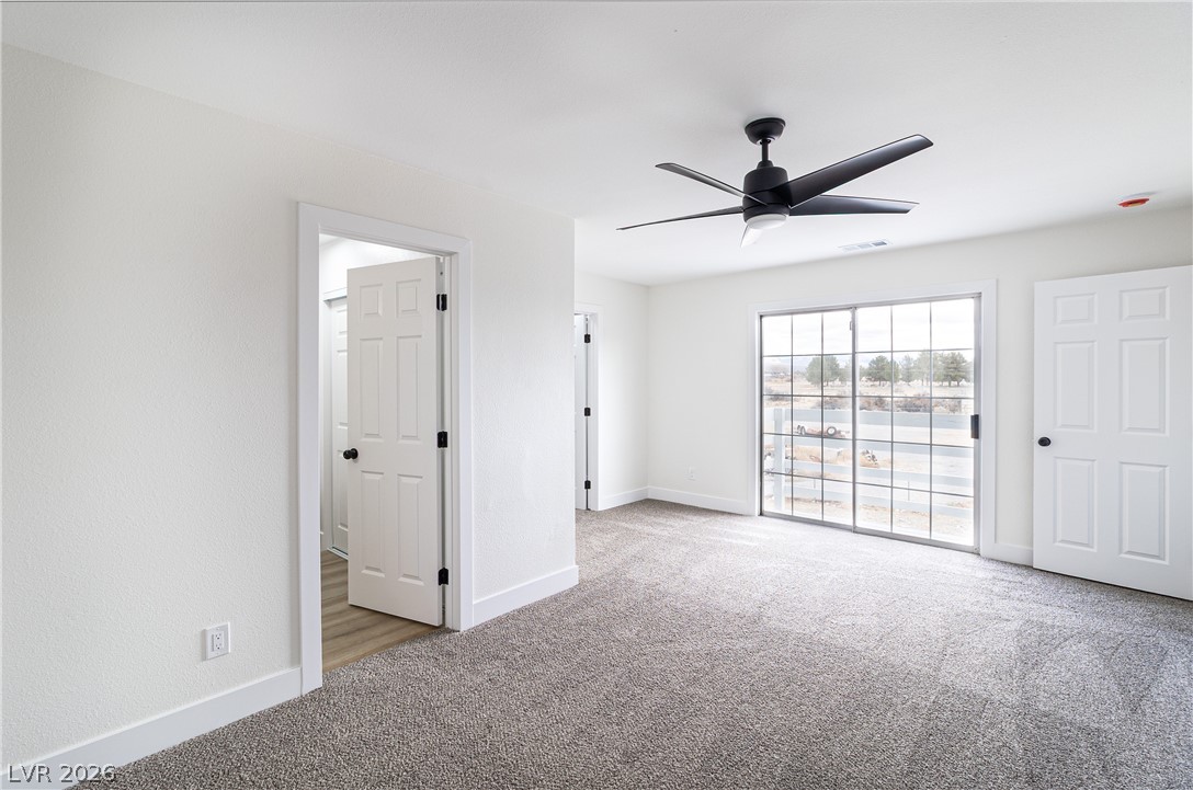 1891 Brian Road Pahrump, NV 89048 - Photo 29 of 50 Carpeted spare room featuring visible vents, baseboards, and ceiling fan