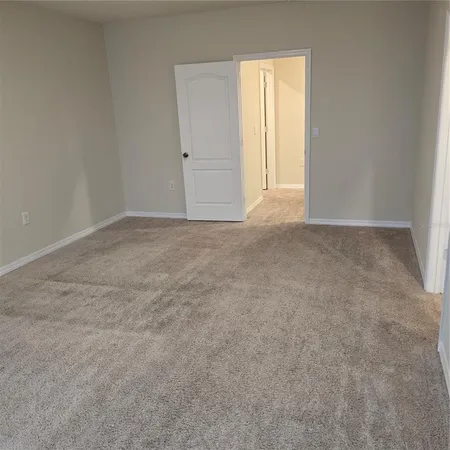 a bathroom with a shower and a door