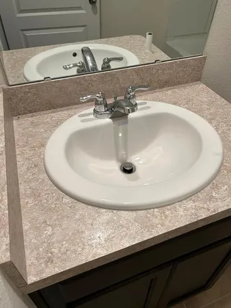 a kitchen with a stove and a sink