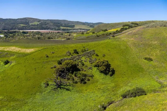 a view of an ocean and a mountain