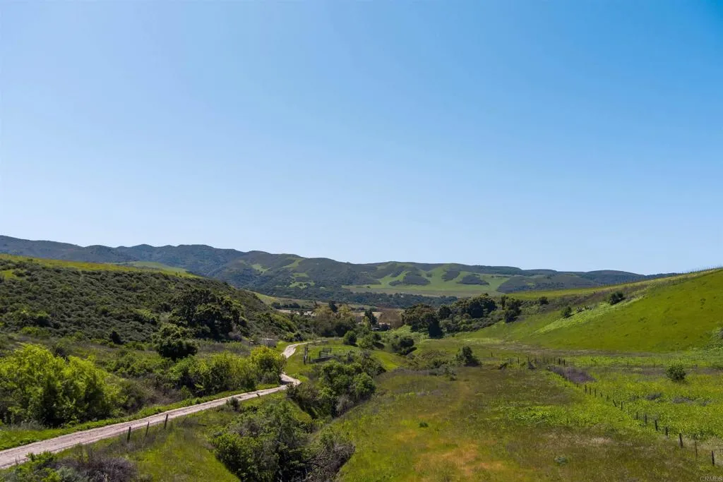 0 Sweeney Road Lompoc, CA 93436 - Photo 32 of 36 a view of a lush green forest with mountains in the background