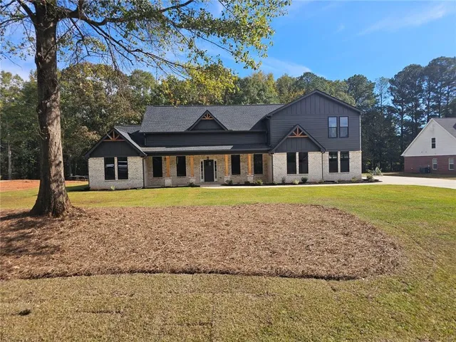 a house with trees in the background