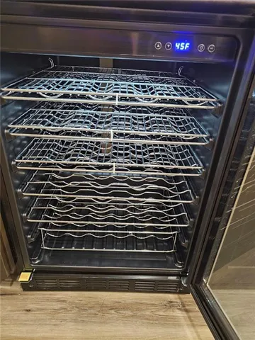 a kitchen with stainless steel appliances granite countertop a stove and cabinets