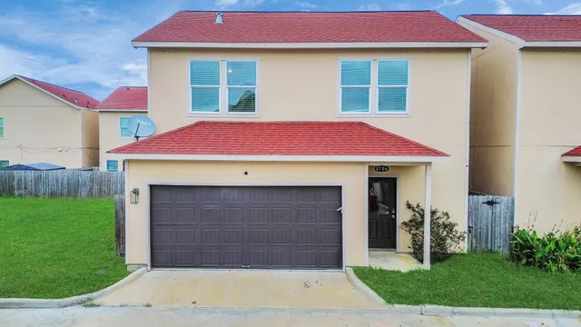 a front view of a house with yard
