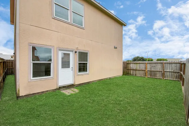 a view of backyard with house