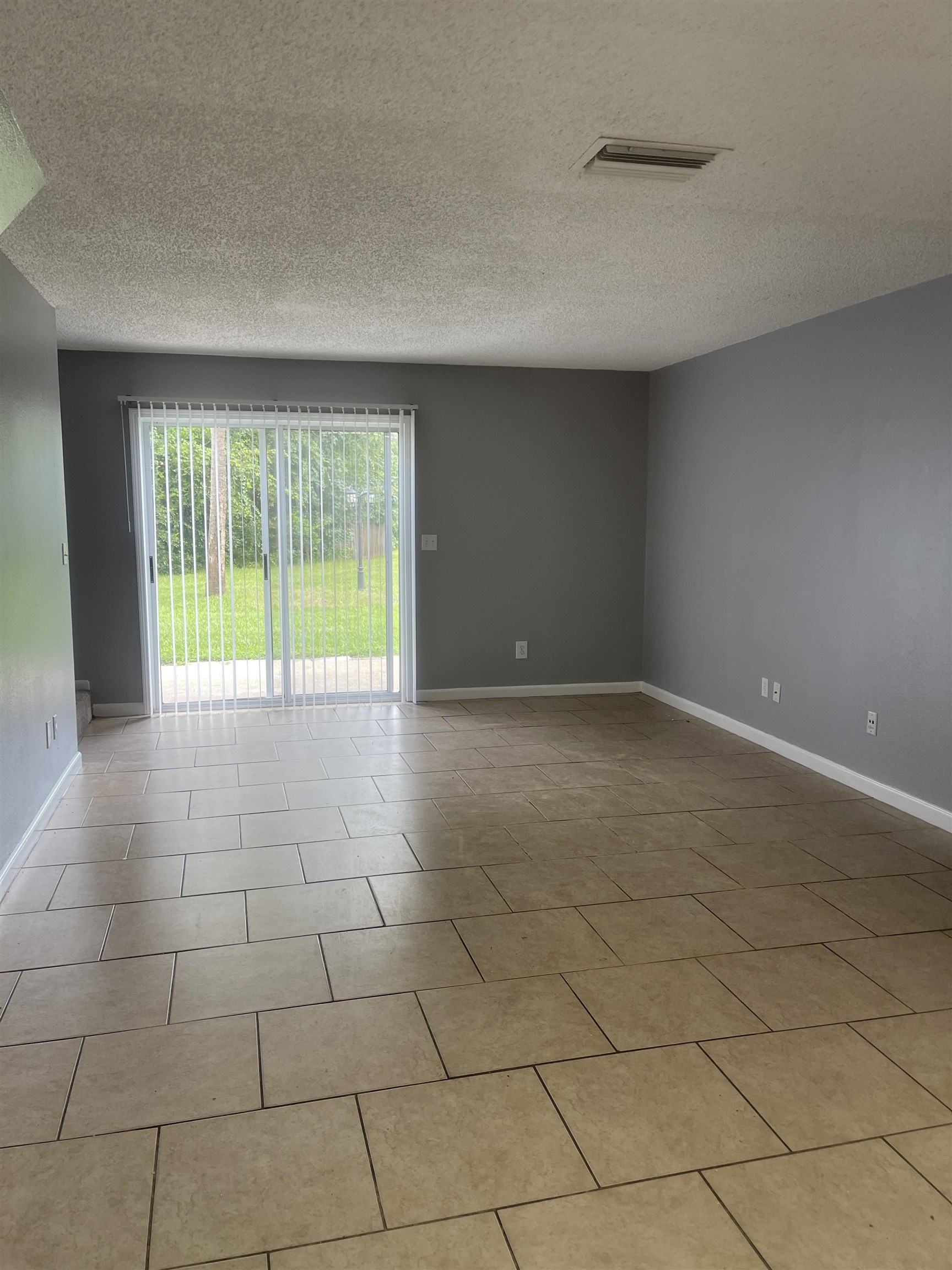4420 Carter Road, Unit 22 St. Augustine, FL 32086 - Photo 4 of 12 a view of an empty room with a window