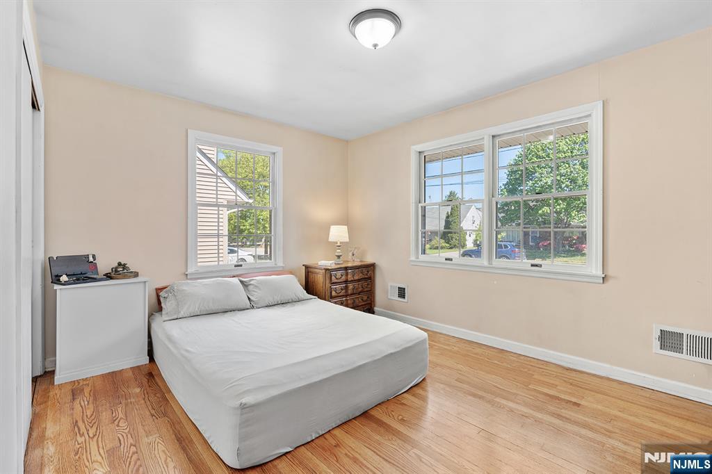 71 Wingra Avenue Rutherford, NJ 07070 - Photo 8 of 20 a bedroom with a large bed and a window