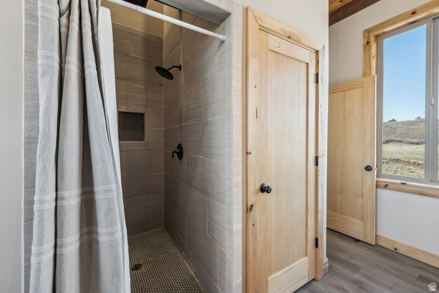 46997 West Thunder Road Fruitland, UT 84027 - Photo 29 of 49 Bathroom with a shower stall and wood finished floors