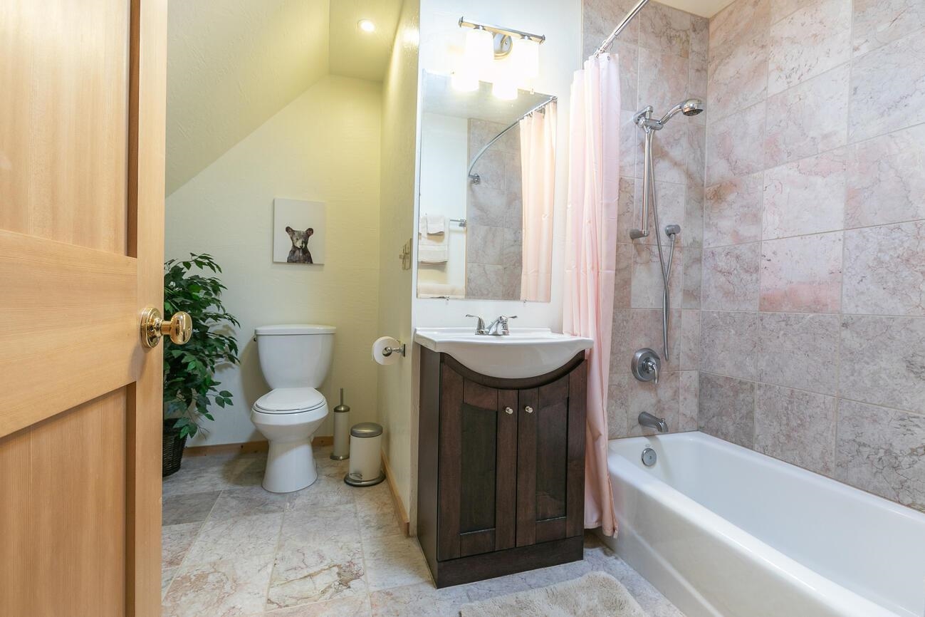 1711 Smith Lake Road Graeagle, CA 96103 - Photo 15 of 26 a bathroom with a sink toilet and shower