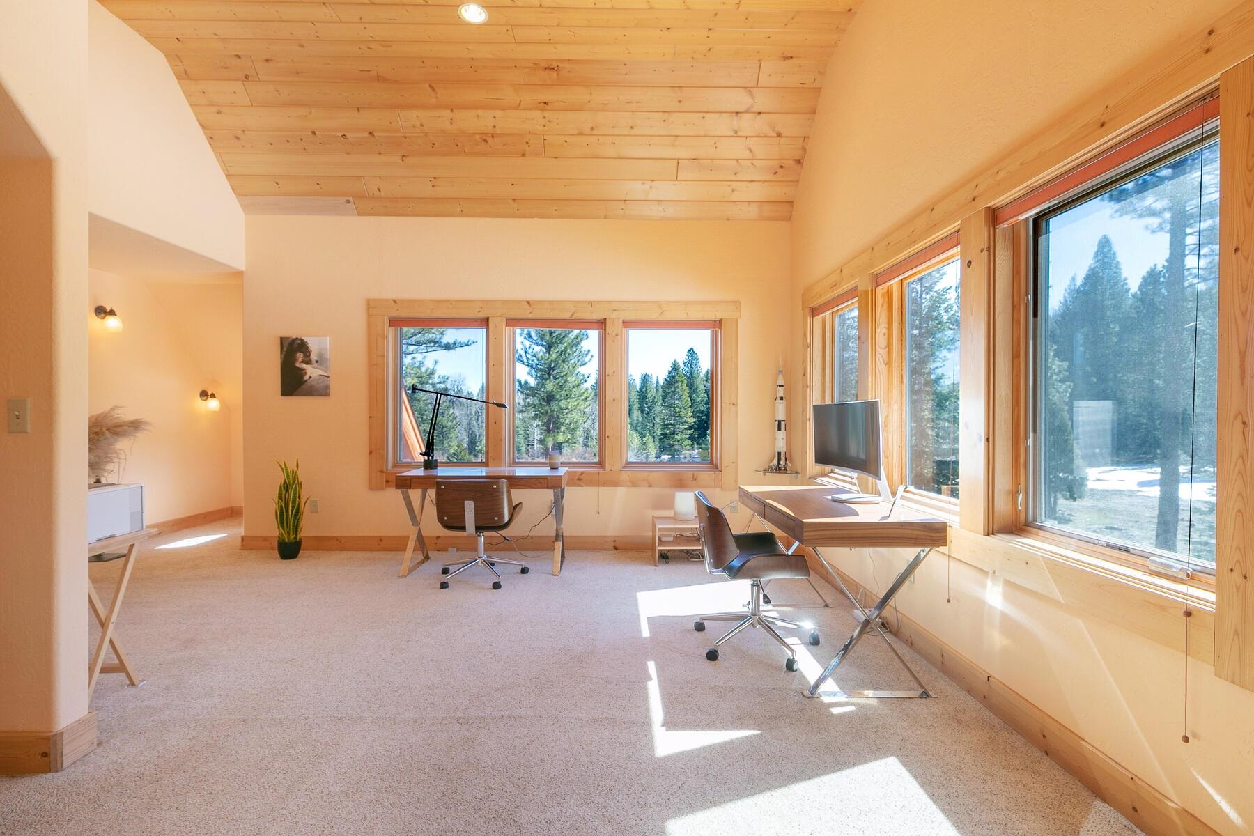 1711 Smith Lake Road Graeagle, CA 96103 - Photo 17 of 26 a living room with furniture and large windows