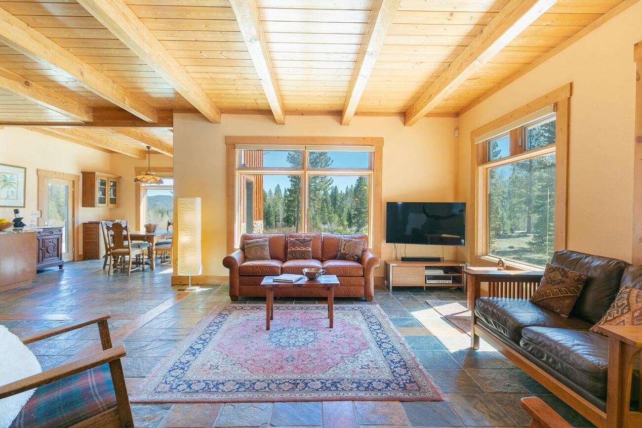 1711 Smith Lake Road Graeagle, CA 96103 - Photo 7 of 26 a living room with furniture and a flat screen tv